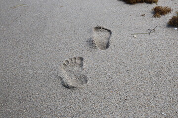 footprint in sand deep alone wet