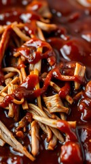 Tender pulled pork, glistening with rich barbecue sauce.