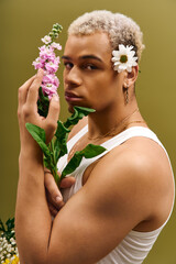Young man with dyed hair embraces floral fashion in trendy studio setting