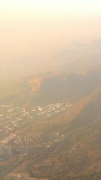 Shil Phata - Mahape Rd, MIDC Industrial Area, Mahape, Navi Mumbai, Maharashtra, India. Mumbai Metropolitan Region. Aerial View From Airplane Window On View of the Mumbai suburb district. Evening