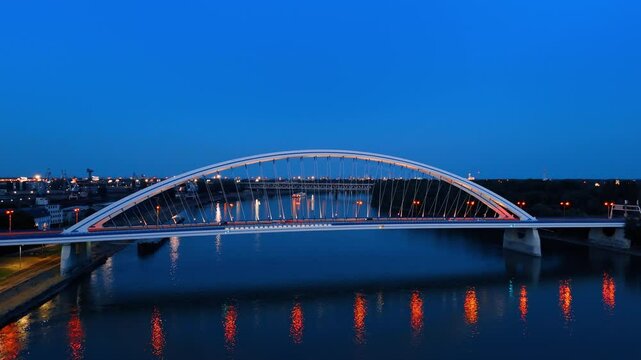 Beautiful road bridge over the Danube in the capital of Slovakia. Lights are on in the Appolo Bridge in Bratislava at dusk time.