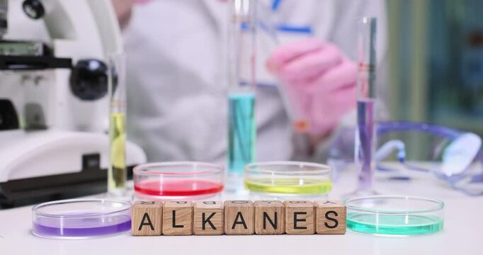 A dynamic lab focused on studying alkanes, with colorful test tubes and petri dishes full of samples