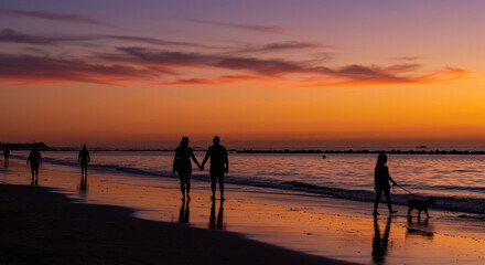 Sunset Silhouettes on Summer Beach
