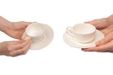 Female hand holding coffee cup and saucer isolated on white background.