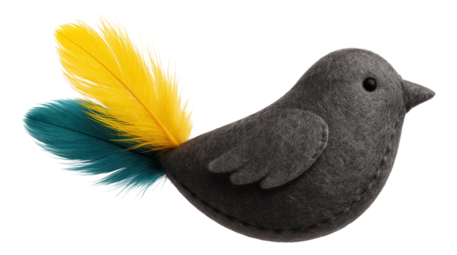 Catnip-filled felt bird toy, featuring feather accents, for a cat to pounce on in an urban loft.