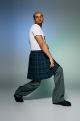 Stylish young man showcasing modern fashion in a sleek studio setting