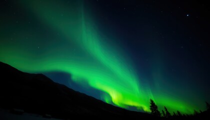 Vibrant green aurora borealis above dark silhouette of a mountain range