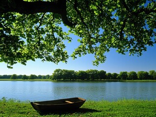 A serene riverside scene with a small wooden boat resting on grass under shaded tree branches, clear blue sky, and distant tree-lined shore.