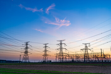 The pylons are in the evening, Substation in the evening, High voltage substation and beautiful sunset glow