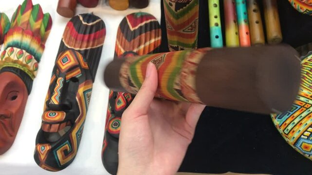 Hand - held Colombian Rainstick, a traditional ethnic instrument or toy. Filled with materials to create a tranquil, rain - like sound, perfect for cultural, musical, and baby - soothing projects.
