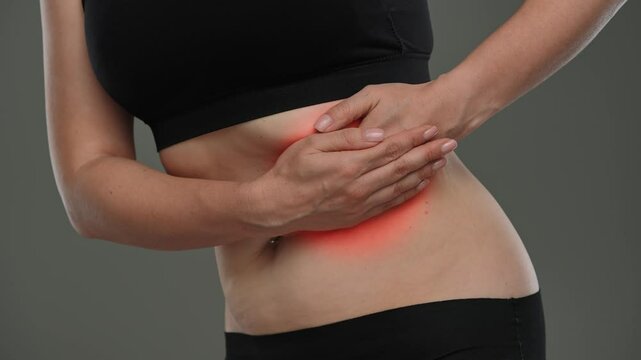 Woman Experiencing Abdominal Pain