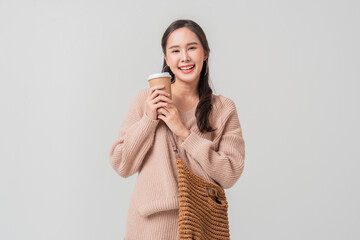 smart casual relax working asian female woman in sweater hand hold coffee cup portrait studio shot...