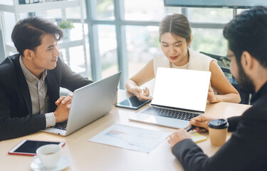 Business working woman using laptop mockup blank screen on table meeting in office.