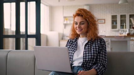 Smiling laughing fun communicate video call conference virtual chat laptop Caucasian woman on couch...