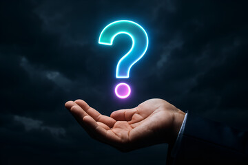 Human hand presents a neon question mark against a dark sky