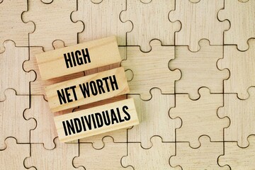 Puzzle and Stick with the words High Net Worth Individuals. HNWIs will have to review their inheritance plans