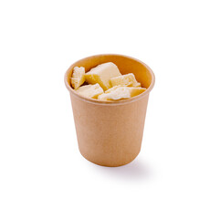 Cubes of fresh cheese served in an eco-friendly paper cup. Simple and healthy dairy snack perfect for salads or appetizers.