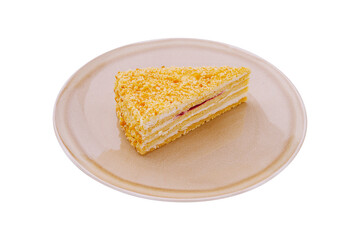 Layered cake slice on a plate with a golden crumb topping