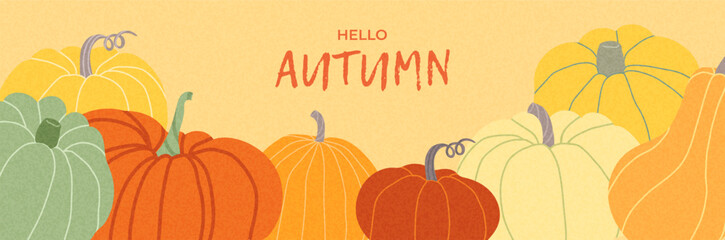 Horizontal autumn banner with cozy pumpkin arrangement in orange, yellow, and cream tones. Hand drawn harvest vegetables on warm background for thanksgiving or seasonal ads