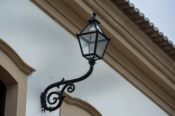 Vintage wall lamp on white building