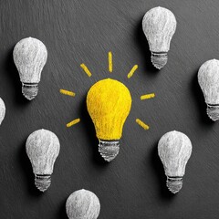 Bright yellow lightbulb surrounded by white lightbulbs on dark surface