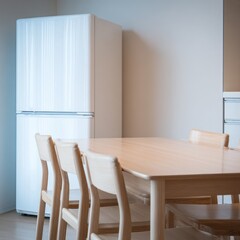 White fridge, light wood table and chairs in a kitchen