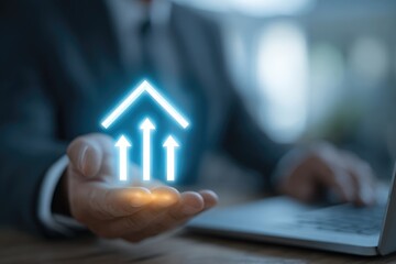 Businessman's hand holding glowing upward-pointing arrows forming a house shape