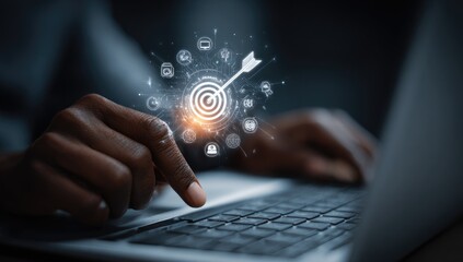 Person's hands on laptop, targeting concept