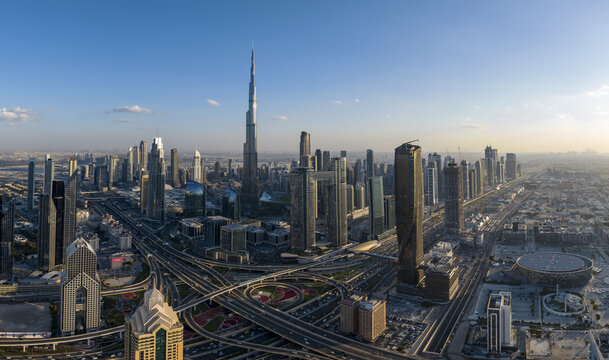 Dubai, United Arab Emirates - 16 June 2025: Aerial view of a sprawling cityscape dominated by the iconic Burj Khalifa, its sleek silhouette piercing the sky.