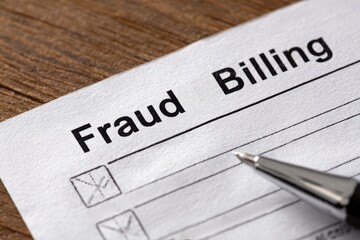 Healthcare fraud legal system  concept. Fraud billing document with checkboxes and a pen on a wooden surface.