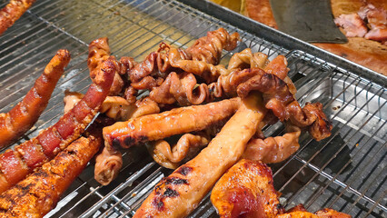 Grilled Pork Intestines and Offal on Street Food Rack.