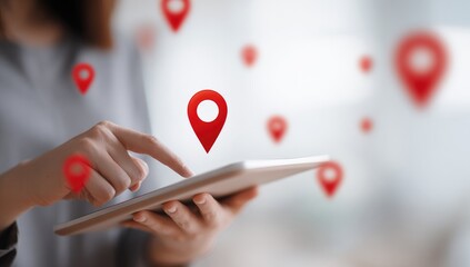 Woman using tablet with location icons