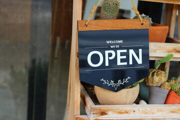 Come in we're open, vintage black retro sign	