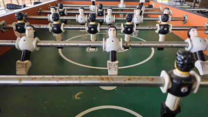 Close-Up of Old Foosball Table with Players