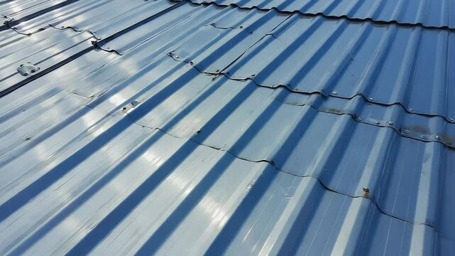 Close up of corrugated metal roofing reflecting sunlight
