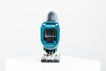 Isolated photo of a cordless jigsaw machine, on white background.