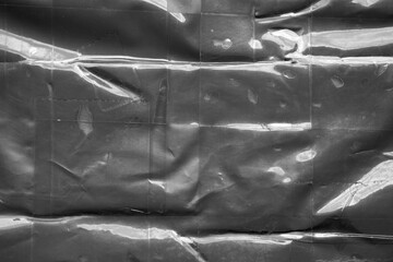 black crumpled and creased plastic bag texture background