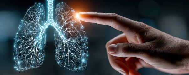 Hand pointing towards glowing digital lungs representing advanced medical technology