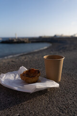 Pastel de nata and coffee on beach, Madeira, Pico Ruivo Vertical