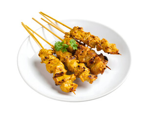 Delicious chicken satay skewers on white plate