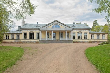 Old Harju manor house in cloudy spring weather, Ravijoki, Finland.