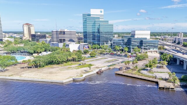 Aerial view of the St. Johns River reflecting the sky, with the Wells Fargo Center and other buildings standing tall against the horizon, Jacksonville, Florida, United States.