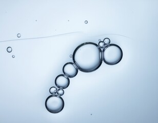 Macro Shot of Bubbles in Water with a Light Blue Background Showing Surface Tension and Abstract Forms Science and Beauty