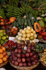 Vertical shot of tropical fruits on display at farmers market