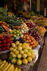 Colorful fruit and vegetable stand at local market vertical