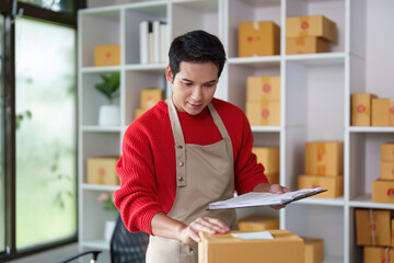 Small Business Owner Organizing Packages for Delivery
