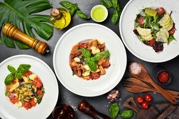 view from above of salads and food on plates. Healthy meal. Top view.