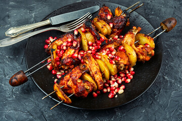 Marinated and grilled chicken wing, skewer.