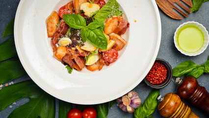 Bowl of fresh caesar salad, plate, on a stone table. Top view copy space. fresh organic salad. Diet food. Healthy meal.