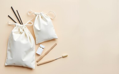 zero waste essentials, flat lay of zero waste lifestyle products with cotton bags, metal straws, bamboo toothbrush on a light neutral background. High quality